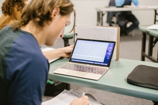 student looking at a computer