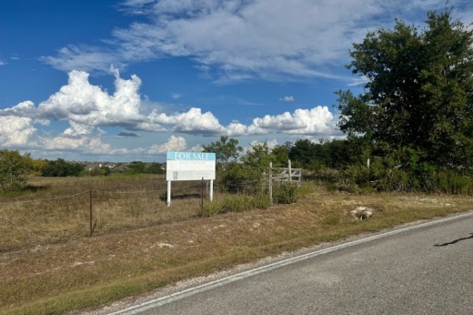 The surrounding area is zoned as a mix of single-family residential, single-family mixed use, agriculture/development reserve and commercial. (Gracie Warhurst/Community Impact)