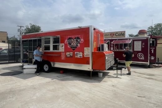 The truck is shown with a person waving and smiling.