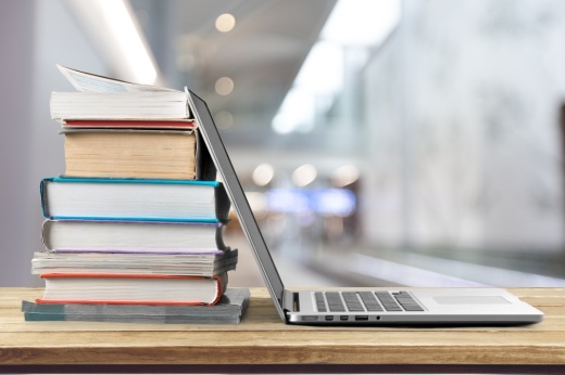 Laptop and textbooks
