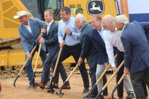 city of Austin officials and BillionToOne executives hold shovels during a groundbreaking event in east Austin