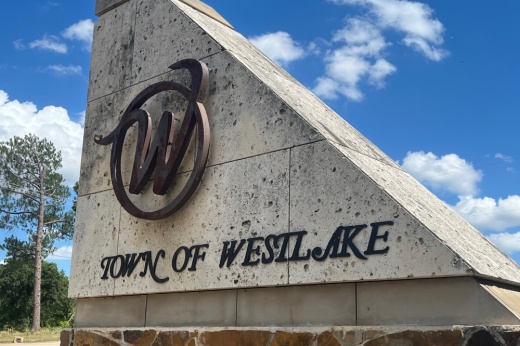 A sign is pictured with the words "Town of Westlake" and the town logo