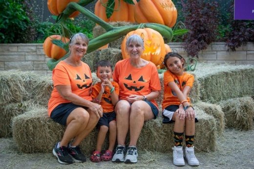 people wearing pumpkin shirts