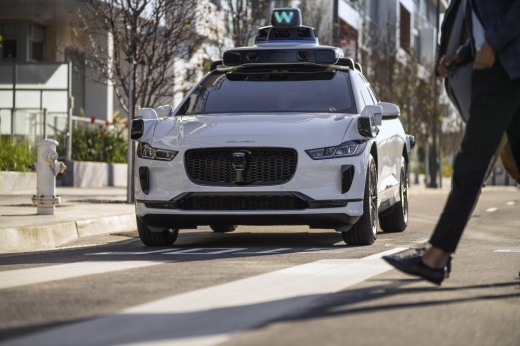 Driverless SUV driving down a city road