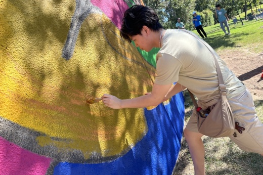 An artist painting a mural