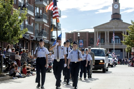 Color guard marching with American Flag