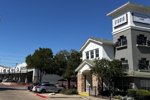 exterior shot of apartment building and retail space