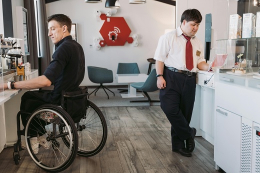 Two employees with disabilities are working.
