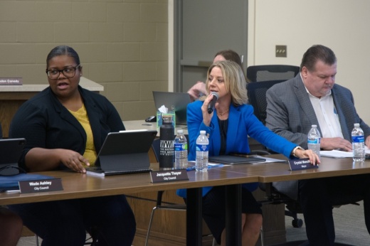 Mayor Crystal Mancilla speaks into a microphone while seated to discuss the sales tax issue.