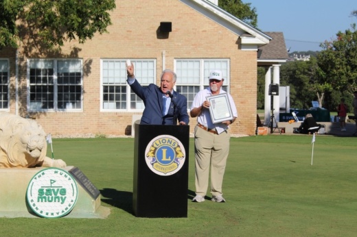 Mayor Kirk Watson speaks to supporters and guests after reading the Proclamation of Lions Muny Golf Course Day at its centennial celebration on Oct. 3. (Sarah Hernandez/Community Impact)