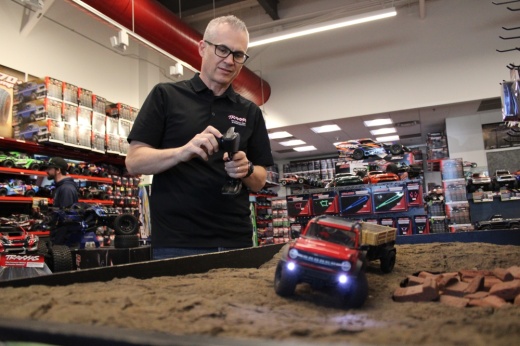A man driving an RC truck