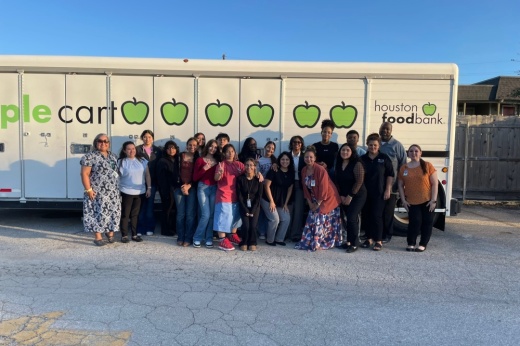 Westfield High School students with Houston Food Bank and Spring ISD leaders in front of a food bank truck