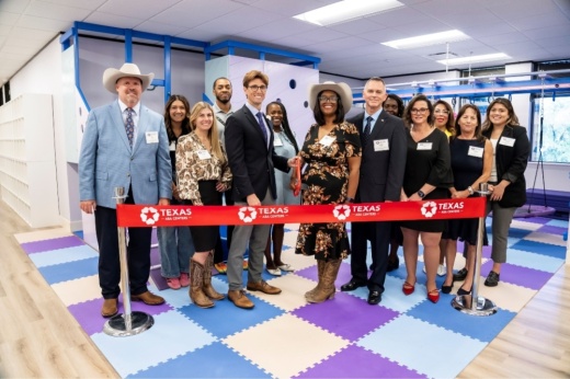 An image of the ribbon cutting for the new location.