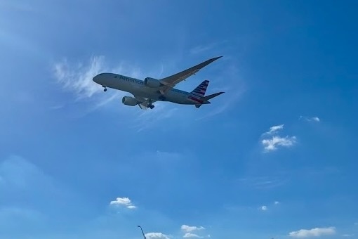 Plane flying through sky