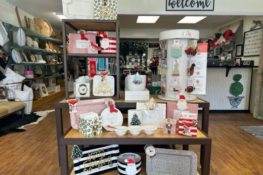 An image of the entrance of the store with Christmas items on display.