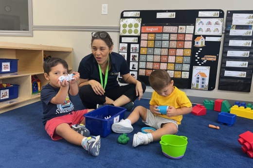 Teacher with students playing with blocks