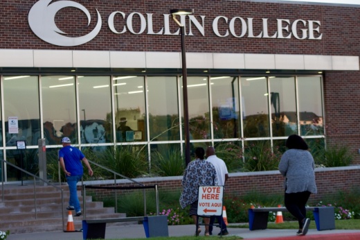 people walk into a polling center