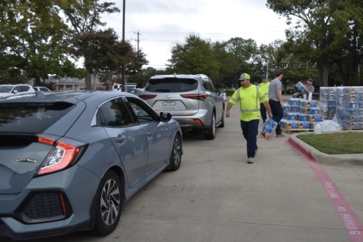 City staff and volunteers distribute water to residents Nov. 7 because of a boil water notice issued for a portion of Richardson.