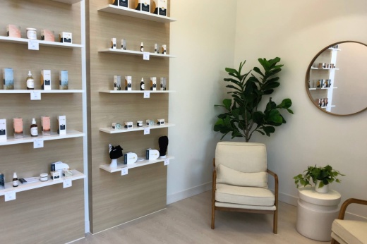 Room with shelves of bottled product.