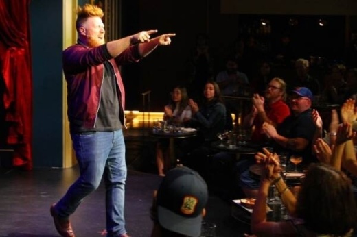 Magician John Michael Hinton on stage