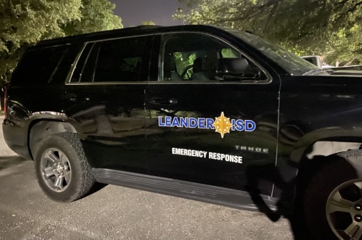 A black SUV that says "Leander ISD emergency services"