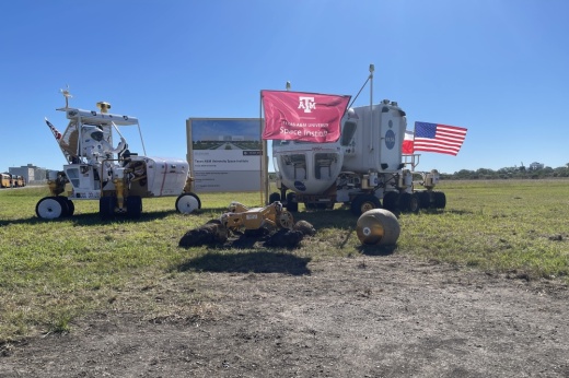 A Texas A&M flag was planted at the sight of the future Texas A&M Space Institute during a groundbreaking ceremony for the site Nov. 15. (James T. Norman/Community Impact)