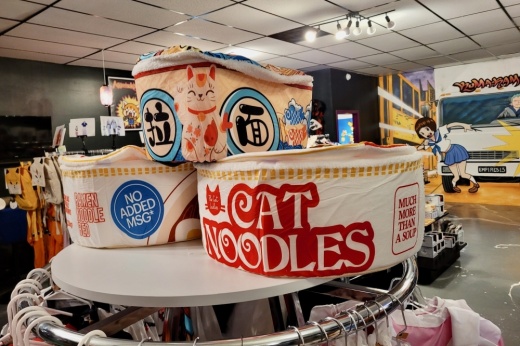 Kuma-Rama character hats on a display shelf