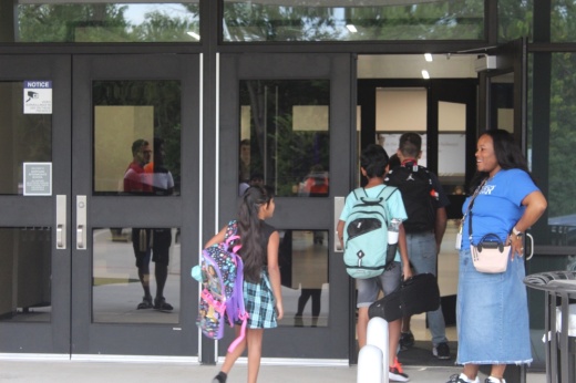 students walk into a middle school