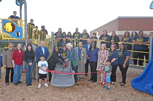 Tipps Elementary School staff and students are joined by government officials and SPARK representatives to celebrate the opening of a new playground on November 19, 2024.