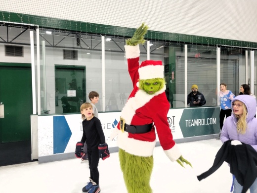 An image of a previous year's event with The Grinch.