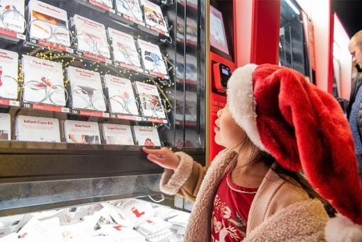 Child looking at The Giving Machine