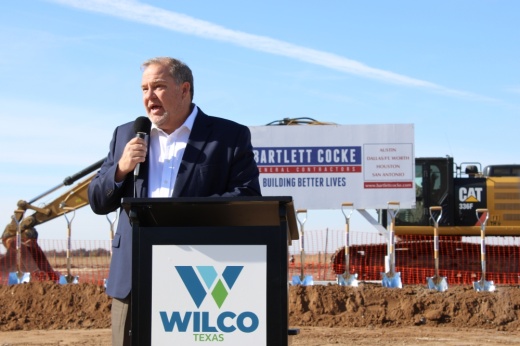 Russ Boles speaks in front of the future site of the West Arena in Taylor.