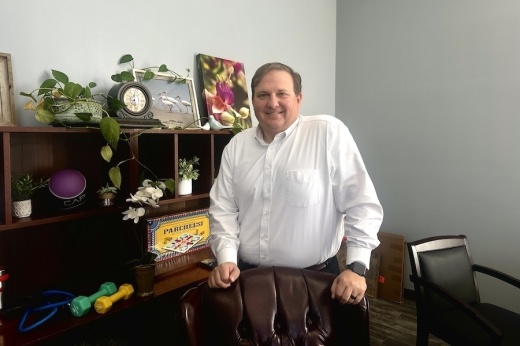 Chris Smith standing in his office