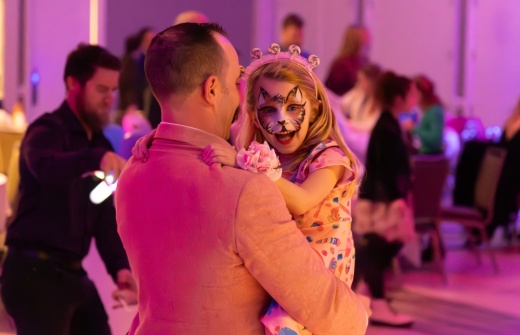 Father holding his daughter