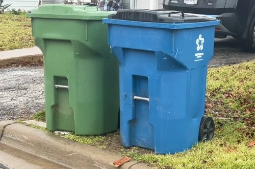 A trash cart and recycling cart from Republic Services sits on the curb in front of a house on Birch Street in Lewisville on Jan. 22