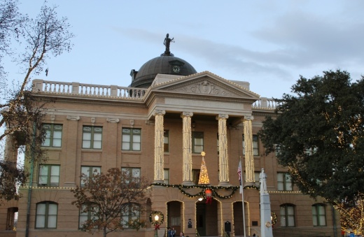 Outside of Williamson County Courthouse with Christmas lights.