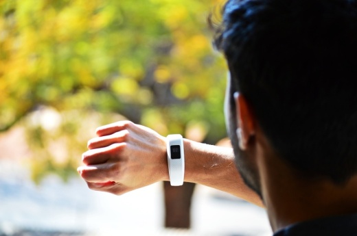 Person looking at wearable fitness tracker