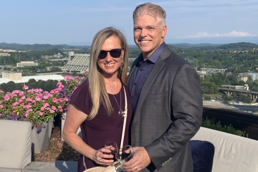 A woman and her husband smile together