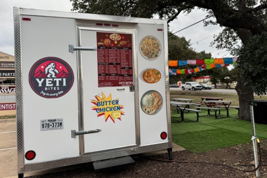 Exterior of Yeti Bites food truck with business logo and menu items