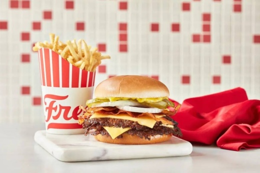 Burger and fries in Freddy's branded container.