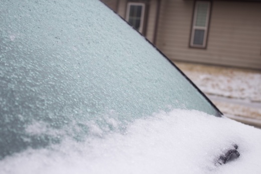 a car windshield that is iced over