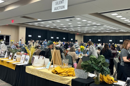 Tables are filled with auction items.