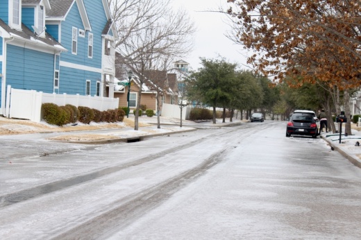 a road iced over in a neighborhood