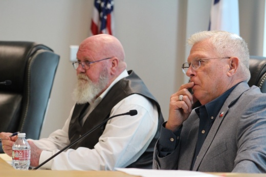 Two men at commissioners court