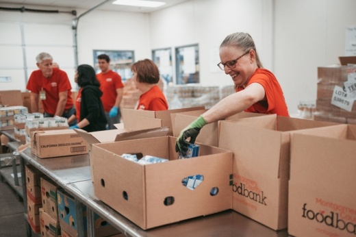 people packing food boxes