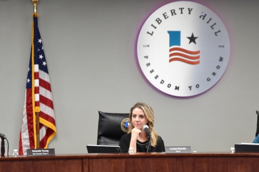 Mayor Crystal Mancilla sits on the dais in Liberty Hill.