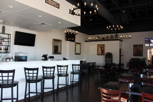 Interior of a restaurant with white, black and brown color shceme.