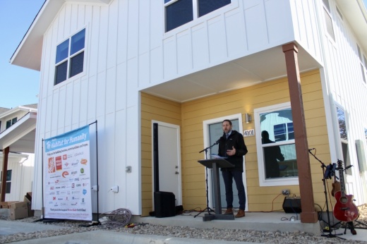 Travis County Judge Andy Brown speaks on the value of affordable housing during a Austin Habitat for Humanity home dedication Jan. 23. (Haley McLeod/Community Impact)