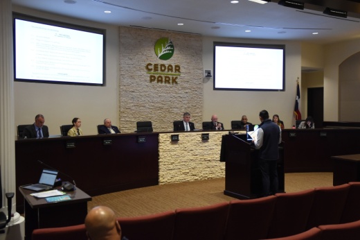 Cedar Park City Council sits on the dais as they hear from a presenter.