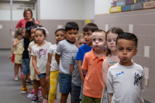 Young students stand in a line